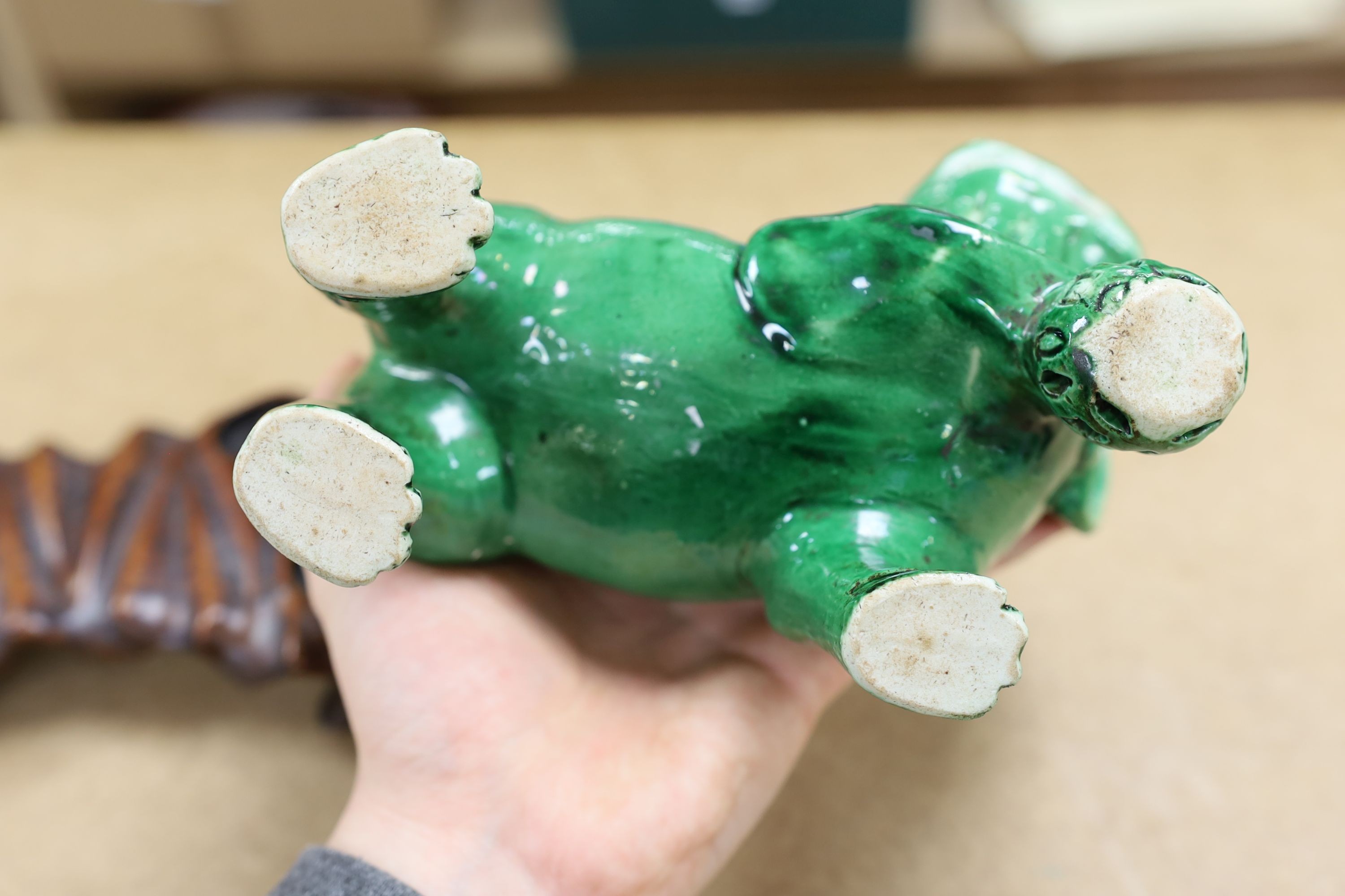 A 19th century Chinese green glazed model of a lion-dog, and two green crackle glaze jars, tallest 16cm